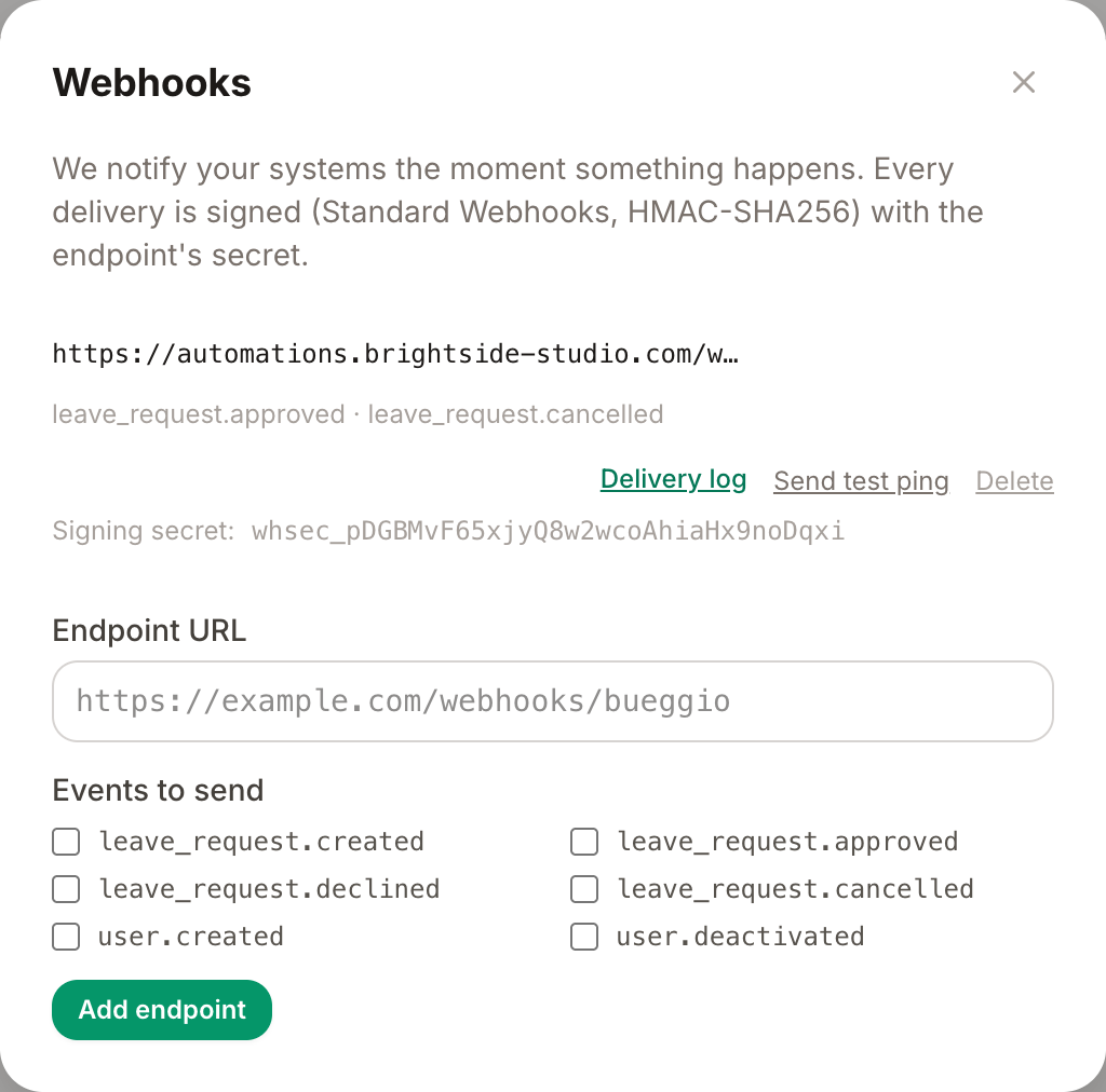 La tarjeta Webhooks en Ajustes → Integraciones: un endpoint activo con su secret de firma, y el formulario para añadir otro